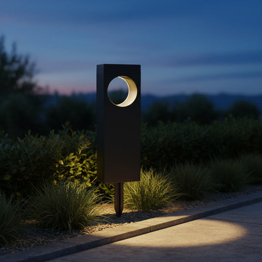 Lunaris Solar Bollard styled in a garden border at dusk
