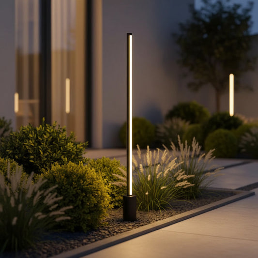 Lumira Bollard Light styled in a modern garden border