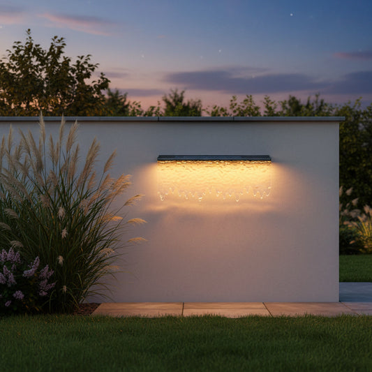 Cascade Outdoor Light styled on a garden wall at dusk