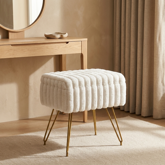 Saffron vanity stool styled in a bedroom