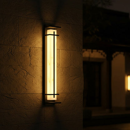 Halcyon Wall Sconce - glowing at night