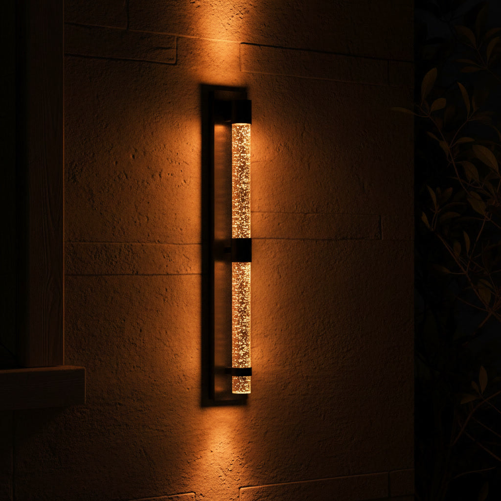 Bastion Outdoor Sconce - glowing at night