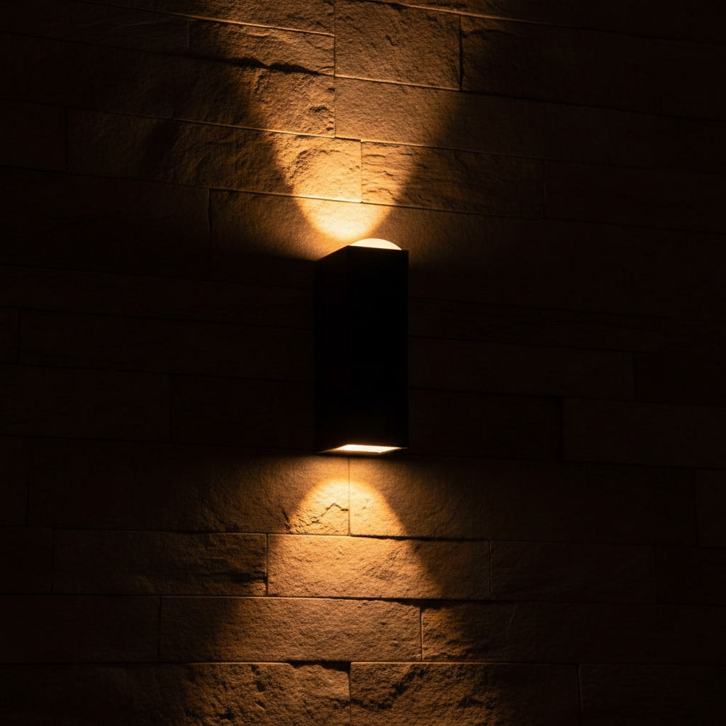 Sentinel Outdoor Sconce glowing at night