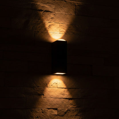 Sentinel Outdoor Sconce glowing at night