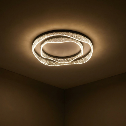 Elara flush ceiling light, lit at night