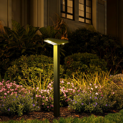 Solene Path Light styled in a garden border