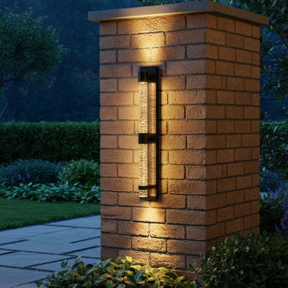 Bastion Outdoor Sconce styled on a garden pillar at dusk