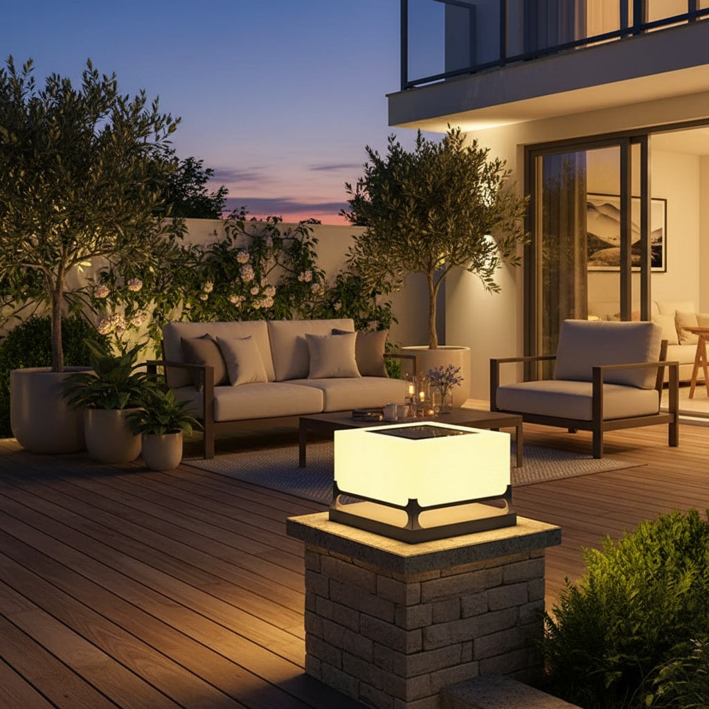 Polaris Pillar Light styled on a backyard patio at twilight