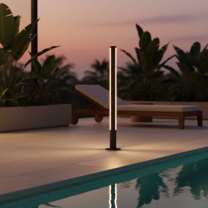 Pharos Bollard Light styled by a poolside patio