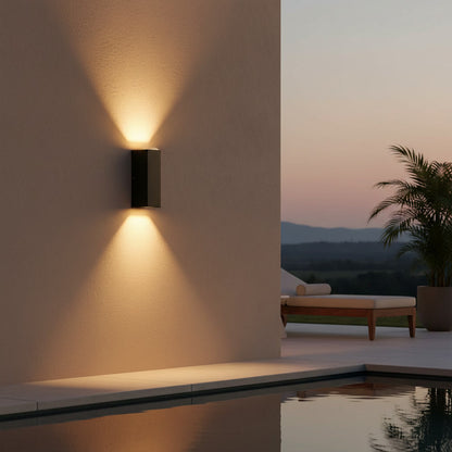 Sentinel Outdoor Sconce styled on a poolside terrace