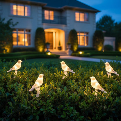 Songbird Solar String - styled along a garden hedge
