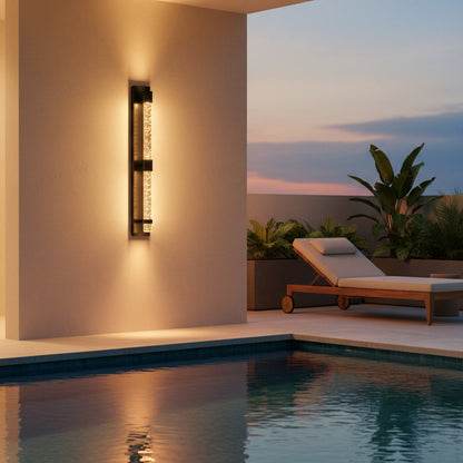 Bastion Outdoor Sconce styled by a poolside at dusk