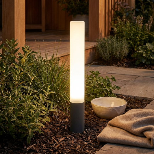 Celeste Garden Bollard styled in a garden border at dusk